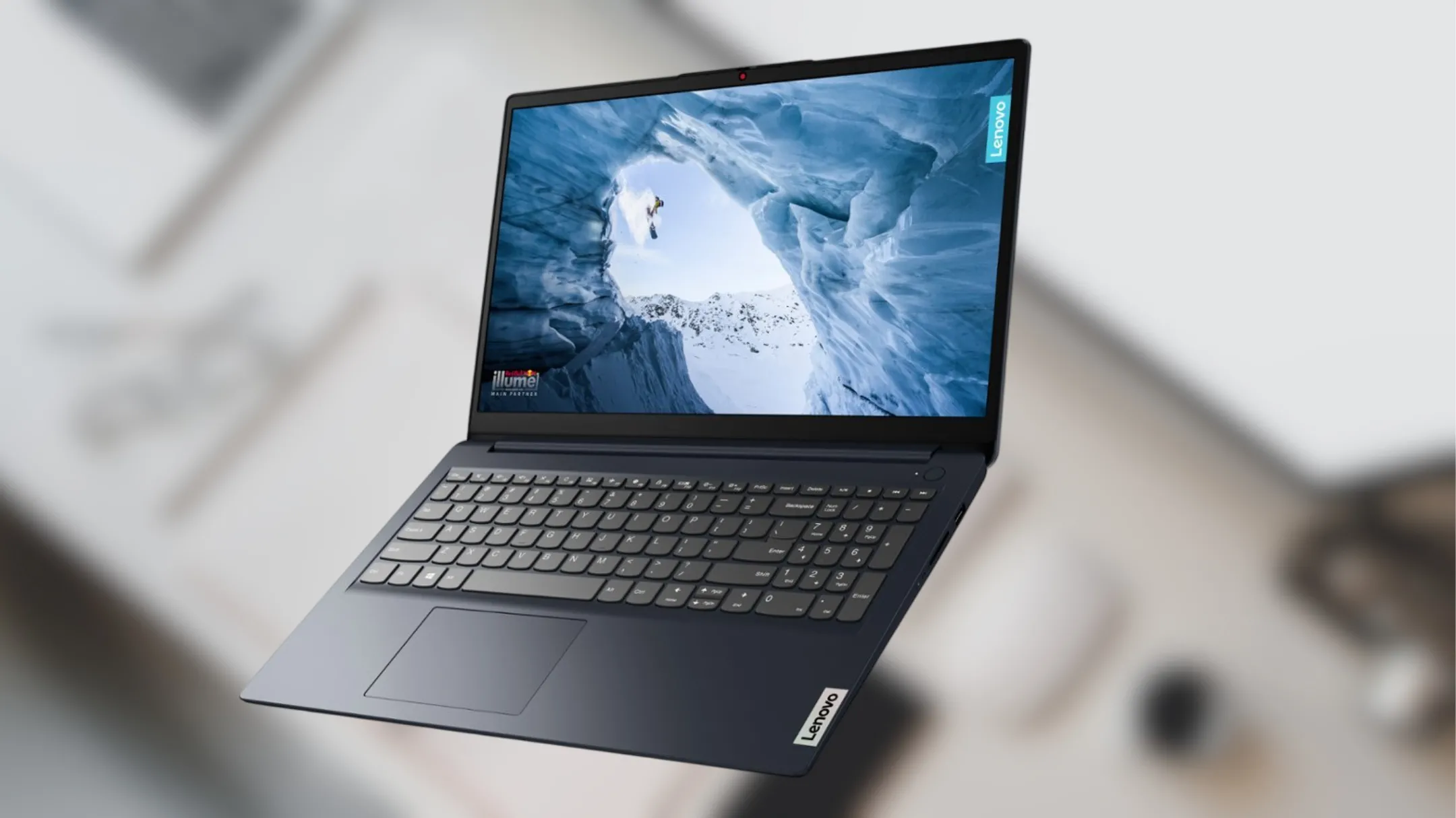 Laptop Lenovo IdeaPad 1i màu xám đặt trên bàn làm việc
