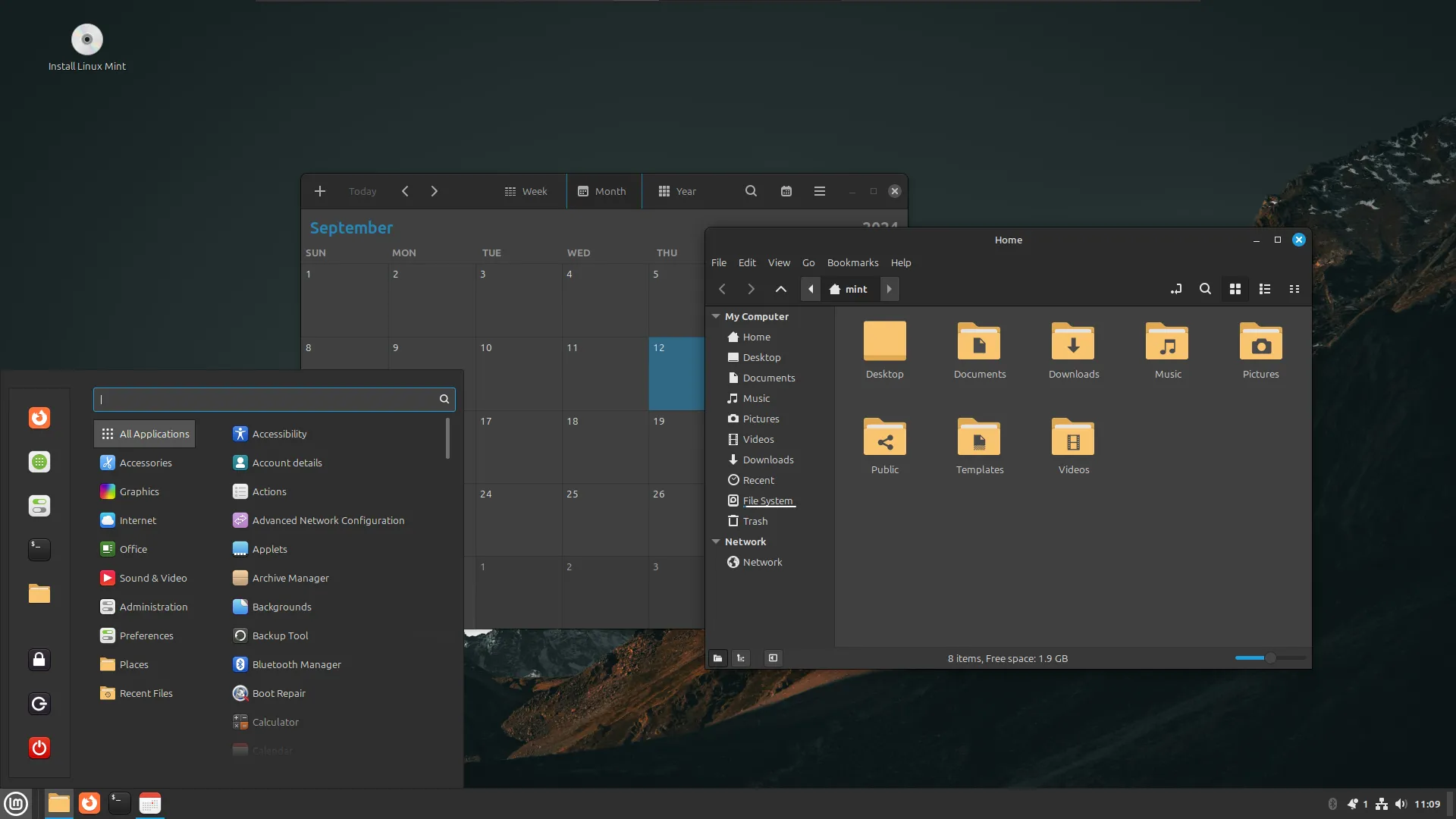 Màn hình desktop của Linux Mint với ứng dụng lịch và trình duyệt tập tin đang mở, minh họa giao diện thân thiện.